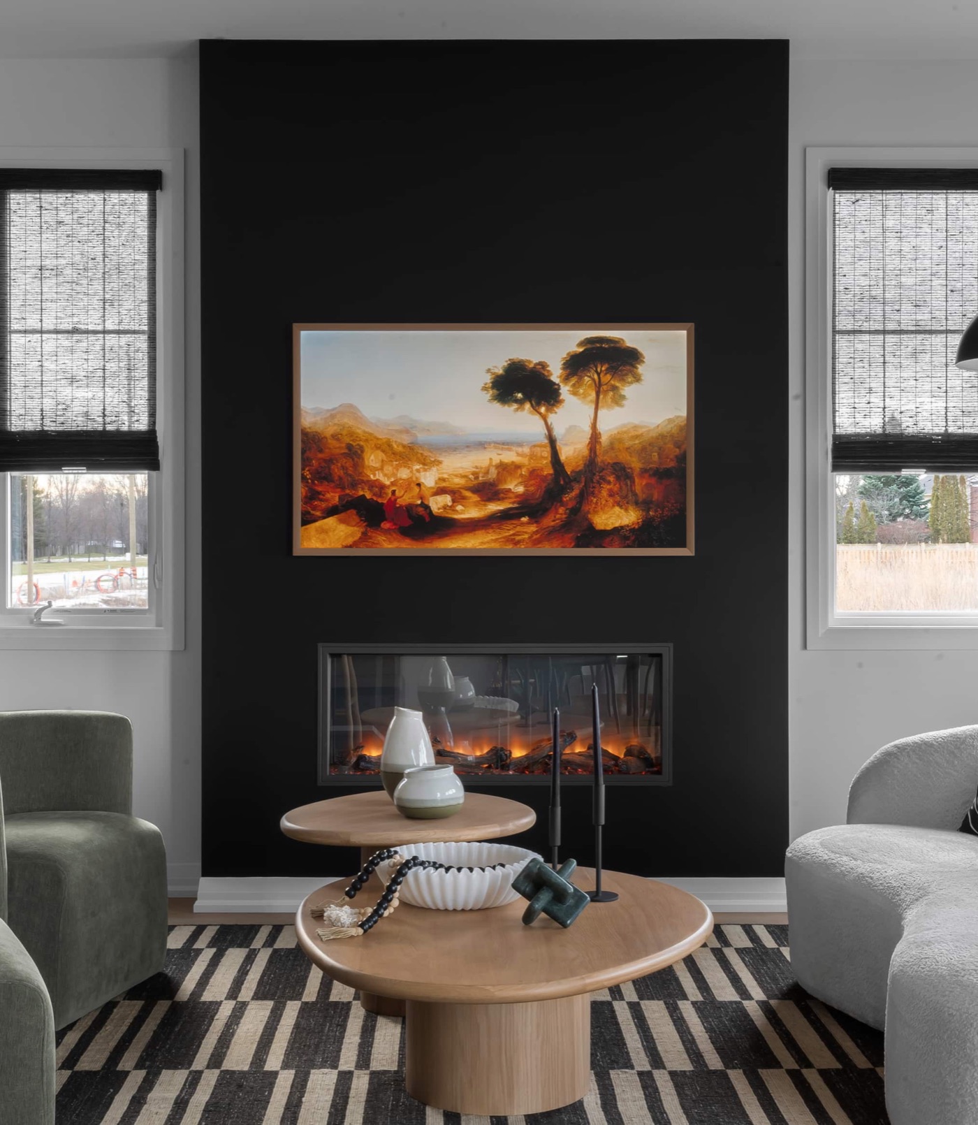 Great room with linear electric fireplace in a decorated Mountainview model home